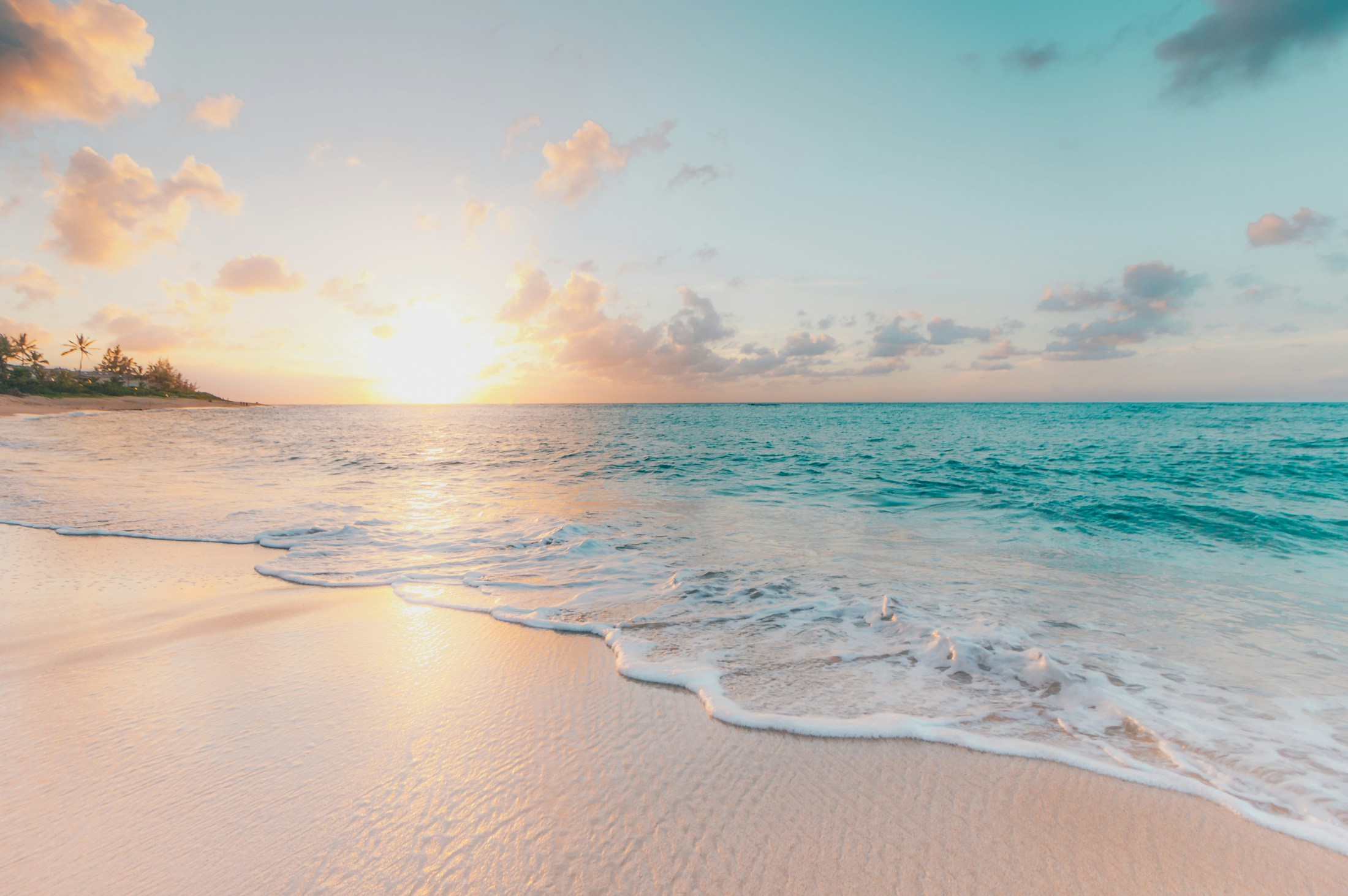 Clear turquoise sea meeting a bright beach